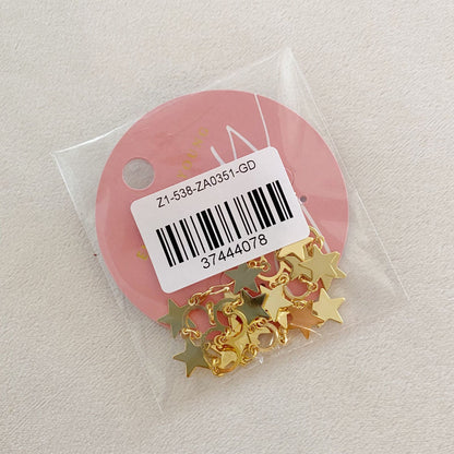 Gold star-shaped charms packaged in a clear plastic bag with a pink circular label, ideal for jewelry making and craft projects.