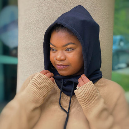 Cozy beige sweater with oversized ribbed sleeves, paired with a stylish navy hoodie for a trendy layered look.