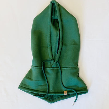 Green pullover hoodie featuring a large front pocket, drawstring hood, and a small logo tag at the bottom, laid flat on a white background.